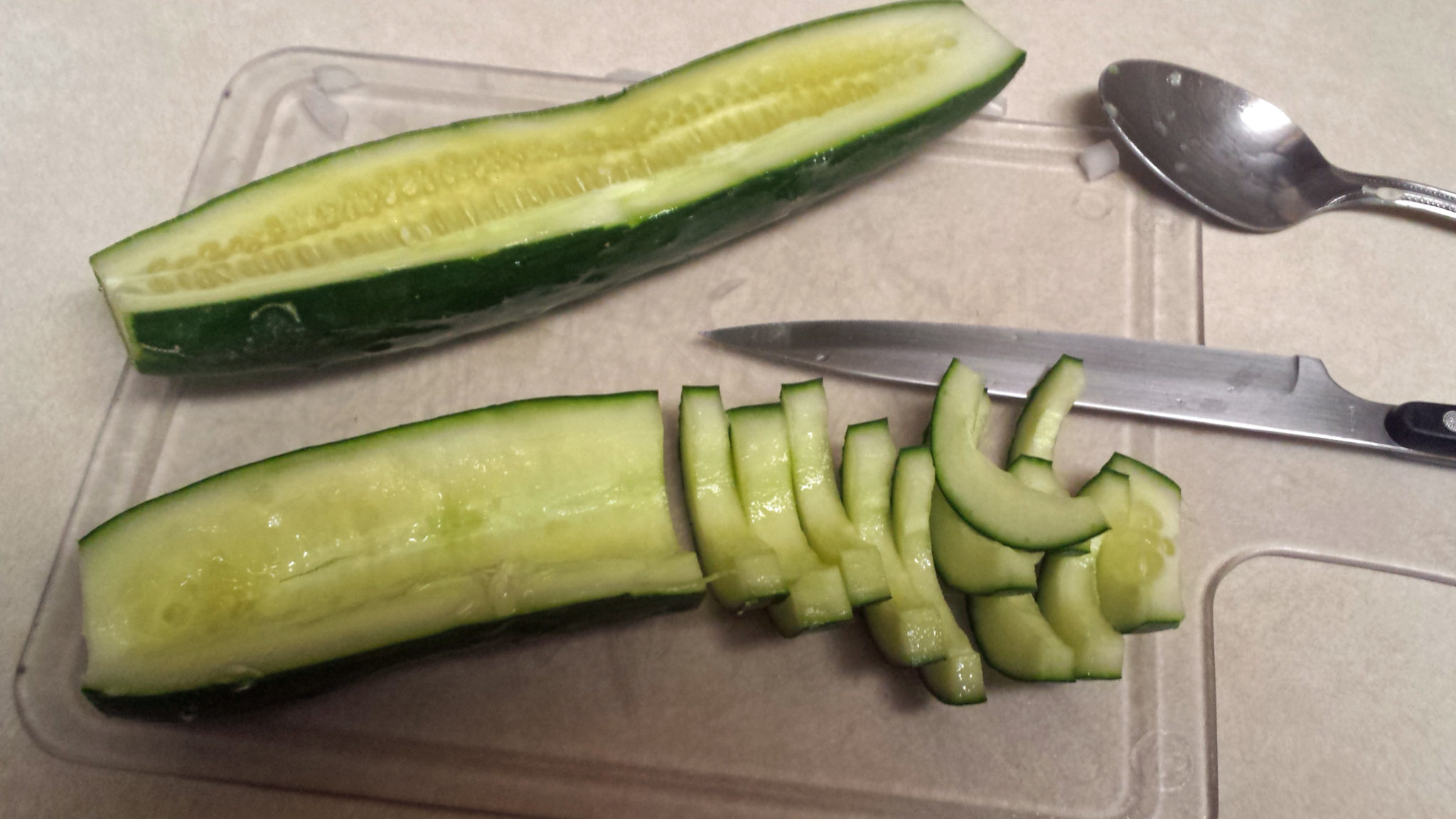 Preparing a cucumber for Thai salad