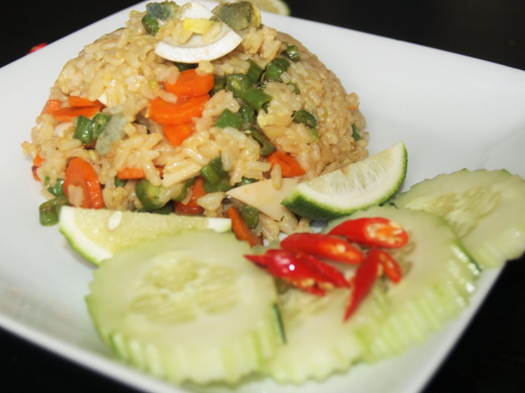 Salted Eggs Fried Rice Served with Cucumber, Thai Chili, and Limes