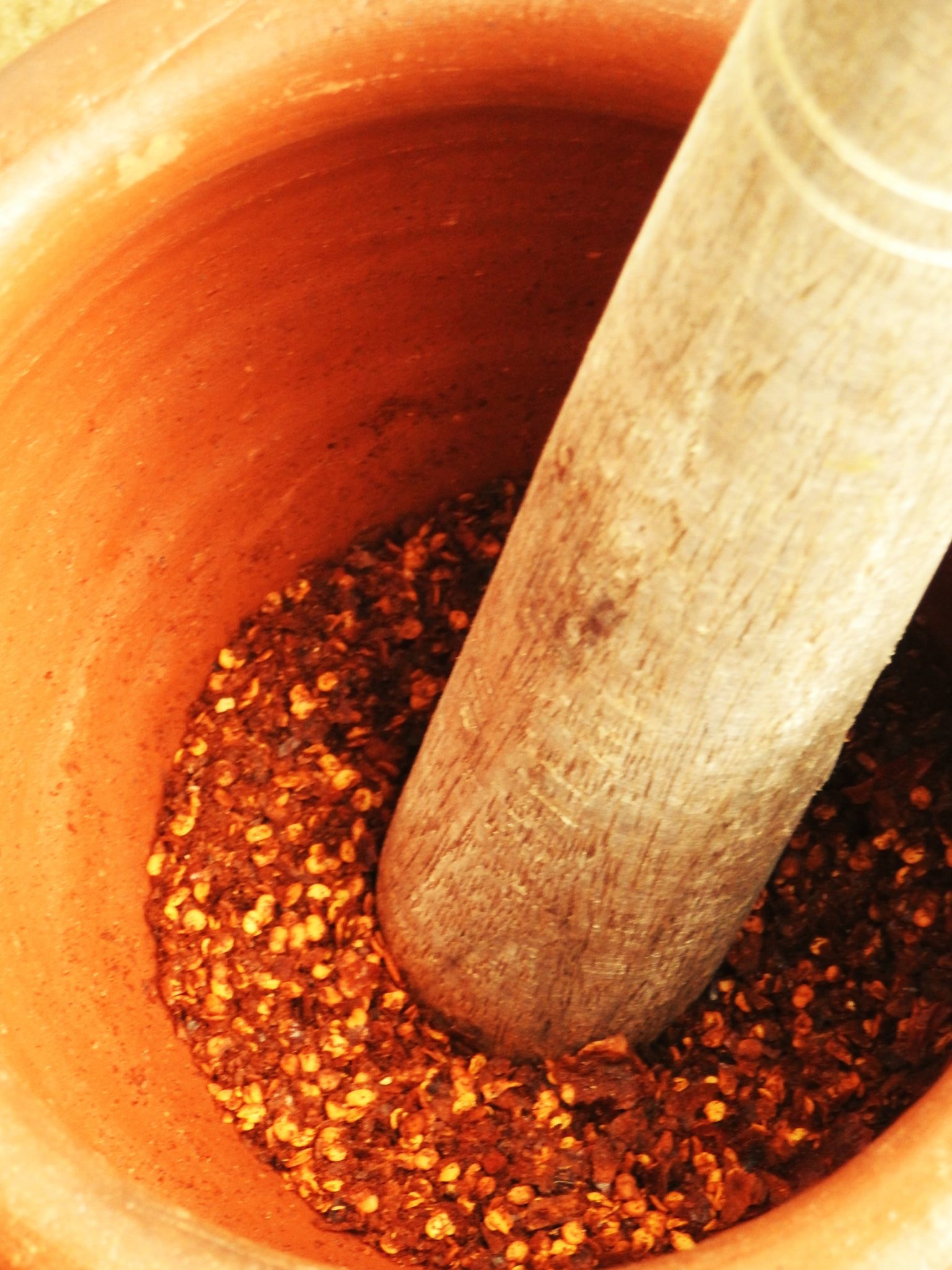 Pounding Toasted Dried Bird's Eye Chili In A Mortar