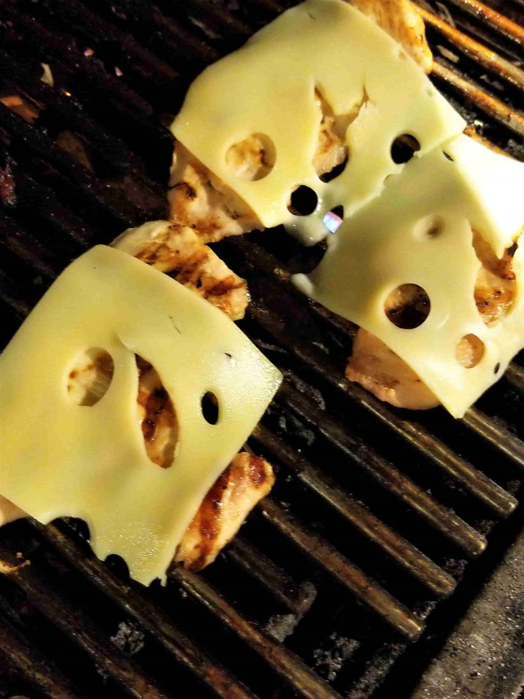 Grilled chicken breast with swiss cheese