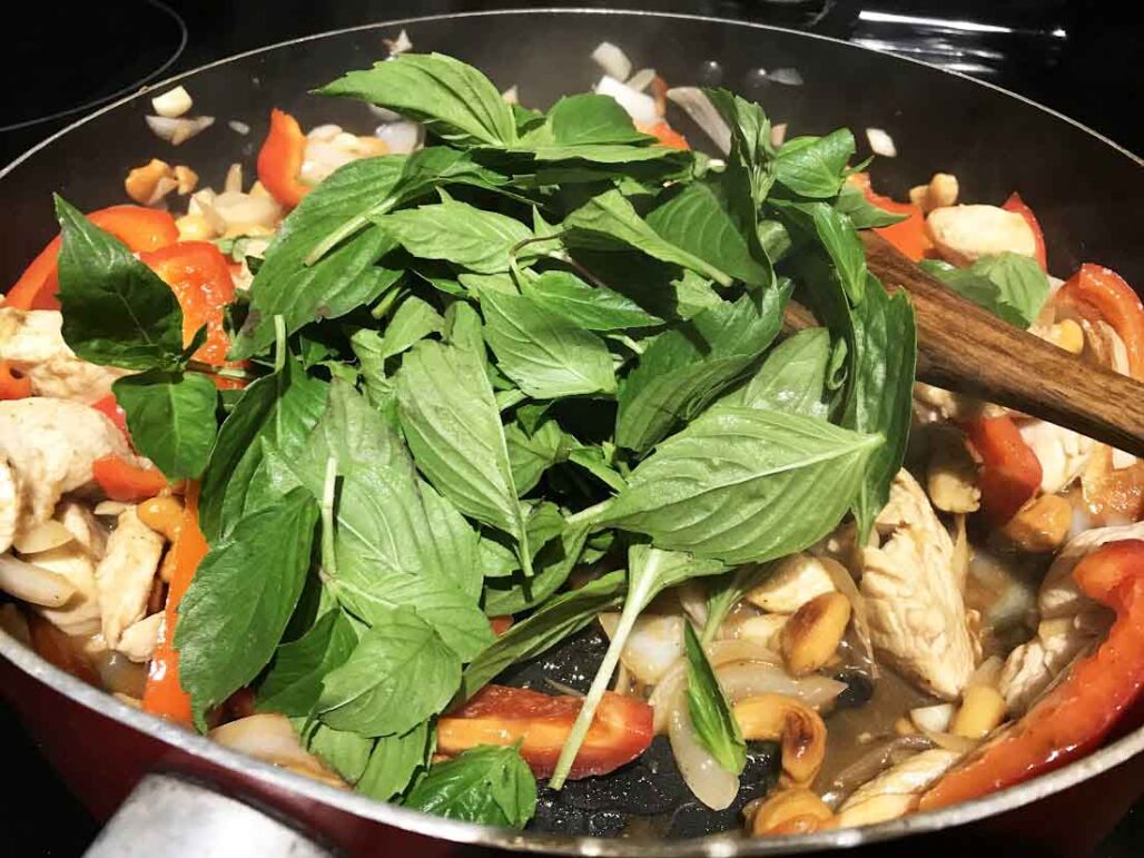 Adding Basil to Healthy Copycat Pei Wei Thai Basil Cashew Chicken Recipe